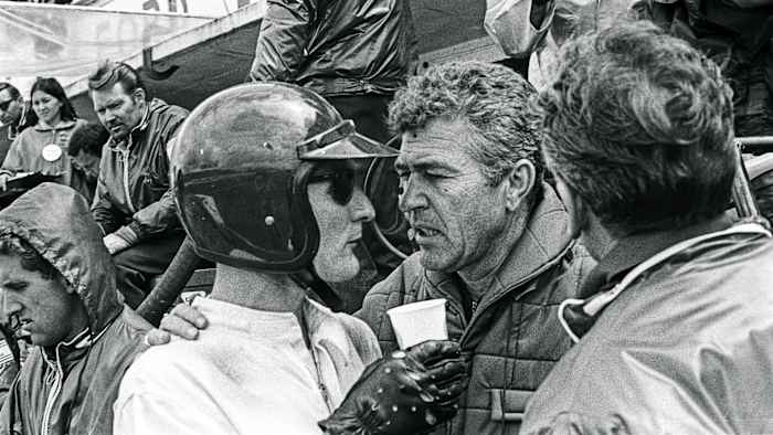 Ken Miles (left) confers with Carroll Shelby during the 1966 race. (Bernard Cahier/Getty Images)